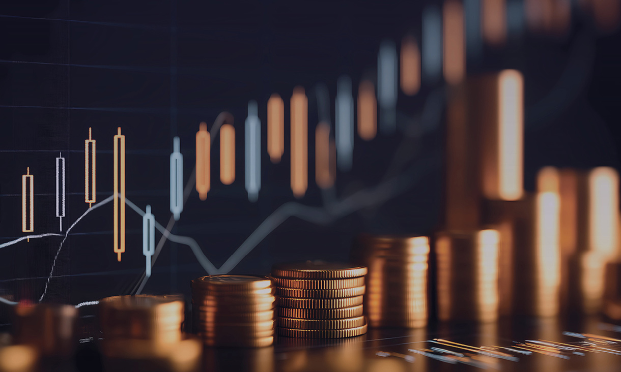 Gold coins with a graph behind them