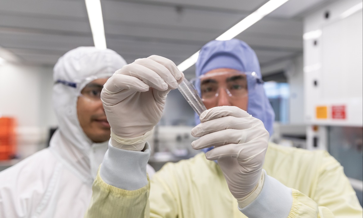 RMIT's Professor Sharath Sriram and Sleeptite CEO Cameron van den Dungen inspect a flexible sensor to be used in non-invasive monitoring for aged care residents.
